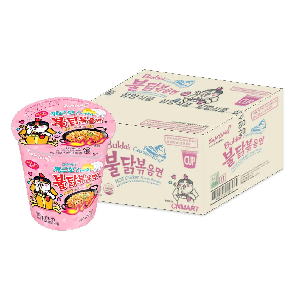 Samyang Buldak Carbonara Hot Chicken Flavour Instant Noodle Cup 80g bulk pack of thirty with outer carton and pink cup packaging, creamy carbonara spicy stir-fried noodles and cartoon chicken character.