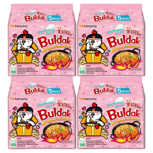 Four Samyang Buldak Carbonara hot chicken flavour instant ramen 5 pack bags in pink packaging, showing creamy stir fried noodles, halal certification and the Buldak chicken character illustration